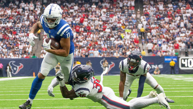 Sep 11, 2022; Houston, Texas, USA; Indianapolis Colts wide receiver Michael Pittman Jr. (11) scores a touchdown against Houston Texans Houston Texans safety Jonathan Owens (36) in the fourth quarter at NRG Stadium.